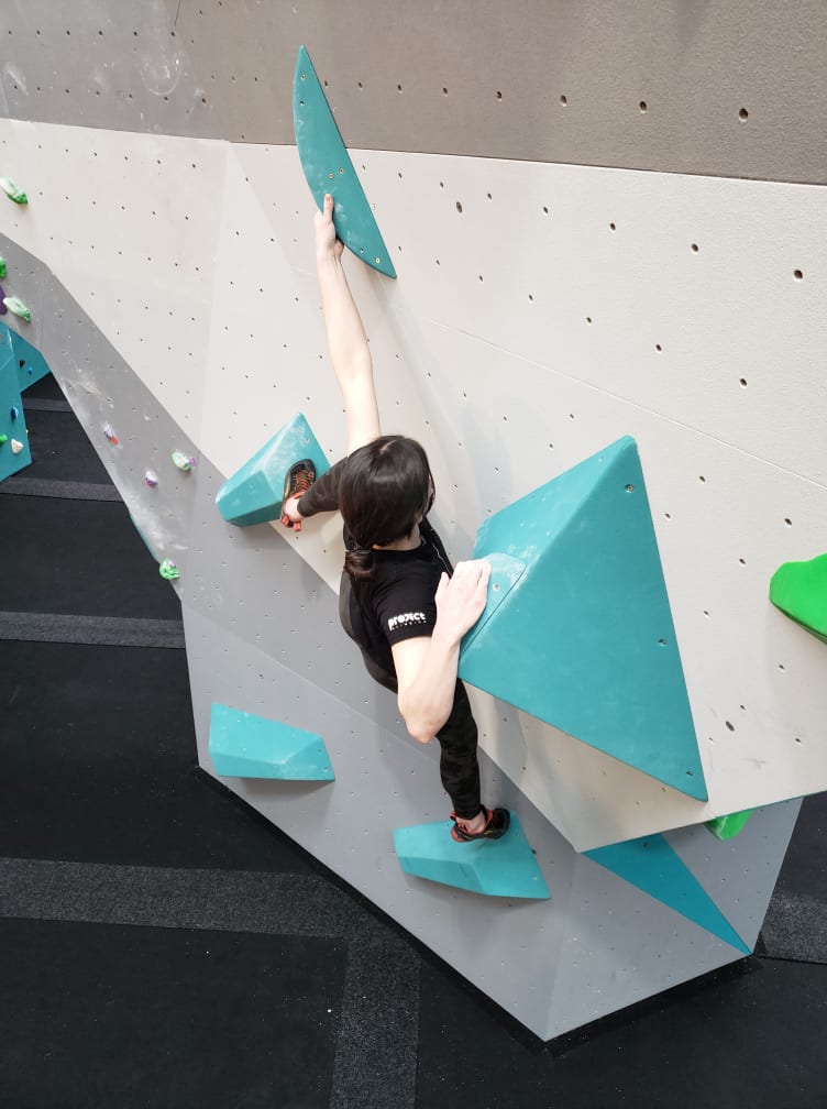 Coaching 3 Young climber on a competition-style boulder