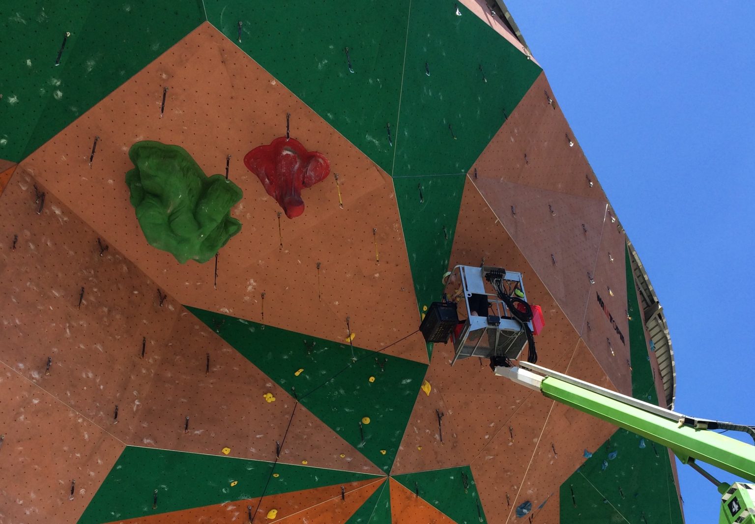 Wall Inspection & Maintenance 1 AS 2316 climbing wall inspection from a boom lift on an outdoor climbing tower
