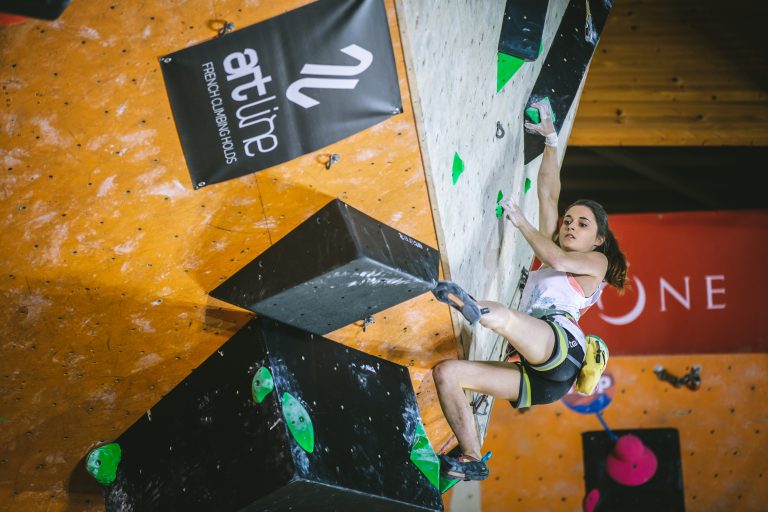 About Us 5 Lead climber on a competition wall